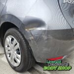 Vehicle with body damage assessed for repair cost at Linwood Coachworks Paisley