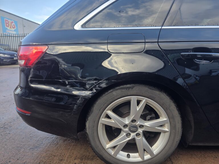 Black Audi with rear panel paint damage at Linwood Coachworks bodyshop Linwood